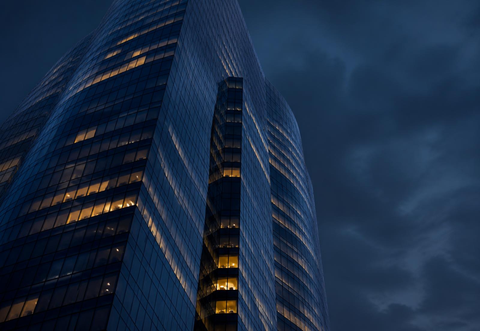 Glass tower in the City of London financial district at dusk